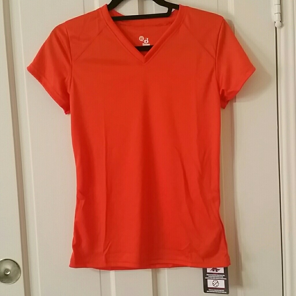 NWT. Ladies orange  athletic  tee. Size XS.